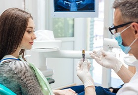 Lady looks at model implant