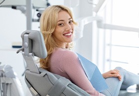 Closeup of smiling patient sitting in treatment chair