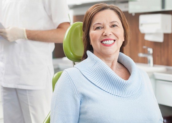 older woman smiling in the dental chair