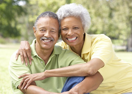 husband and wife smiling