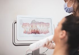 Dentist scanning a patient’s teeth