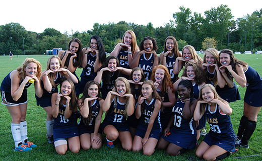 High school sports team with mouthguards in Annapolis