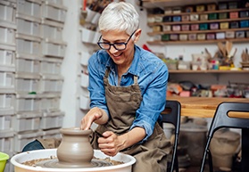 Woman smiling during ceramics class