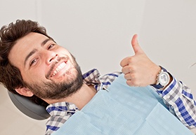 Man giving thumbs up while visiting an emergency dentist in Annapolis, MD