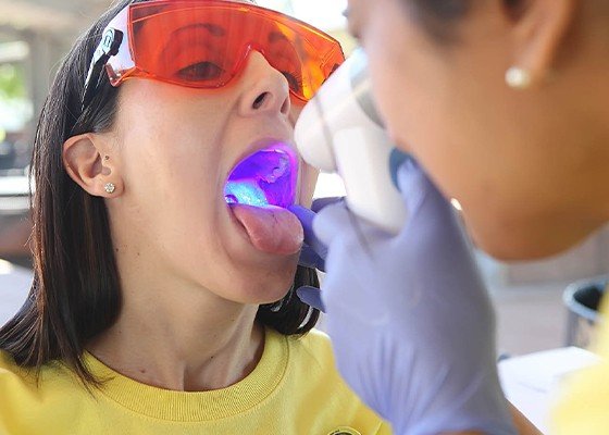 woman getting oral cancer screening