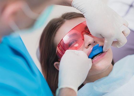 girl getting fluoride treatment