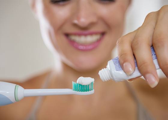 woman brushing teeth