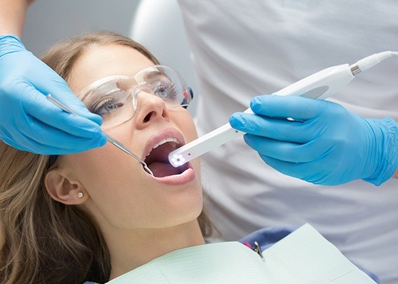 dentist using intraoral camera