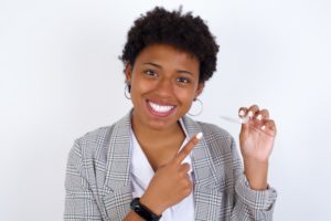 woman smiling with Invisalign after braces in Annapolis