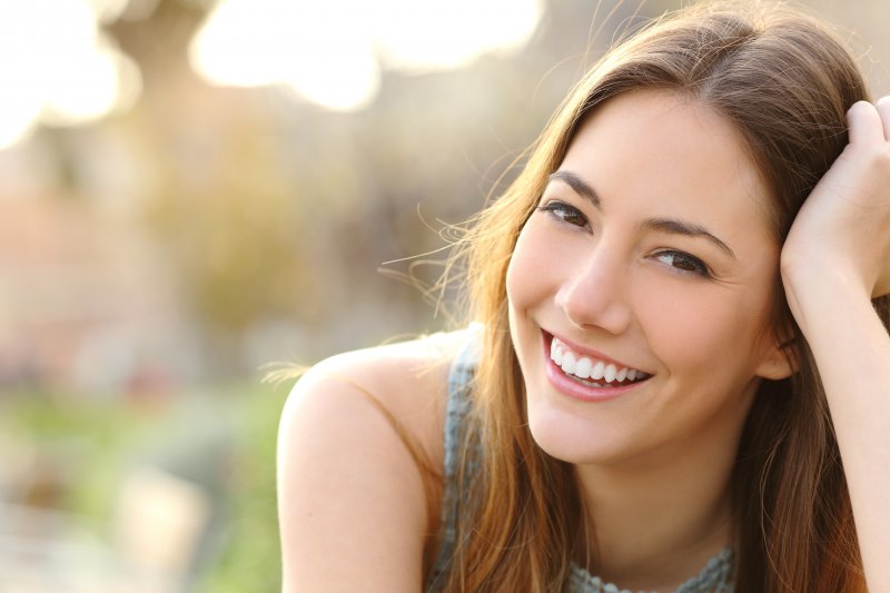 young girl smiling outside