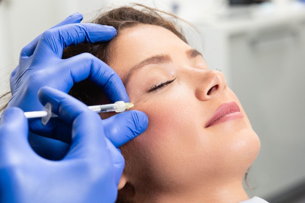 Closeup of dentist administering BOTOX®