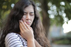 Young woman with dental pain