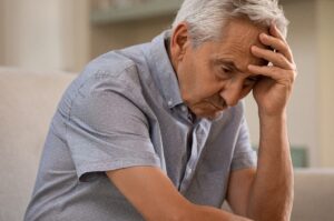 An older man struggling with Alzheimer's