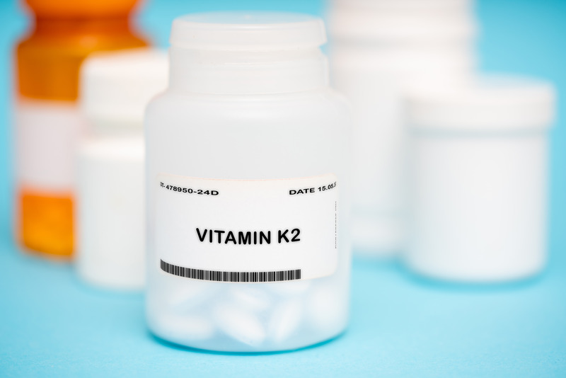 A bottle of Vitamin K2 for jawbone health