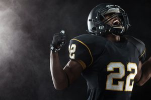 Football player in jersey looking triumphant